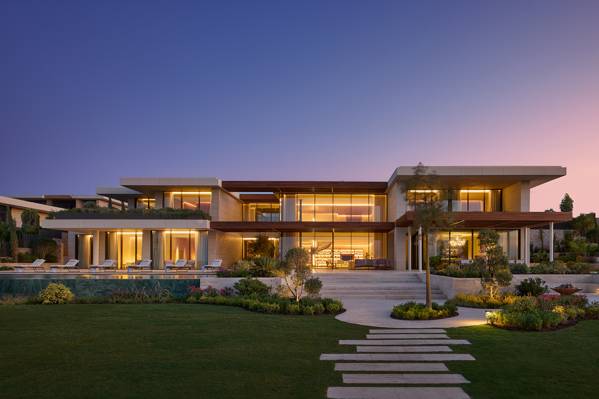 Exterior image of Bulgari's Bodrum Mansion that Includes luscious gardens and private swimming pool.